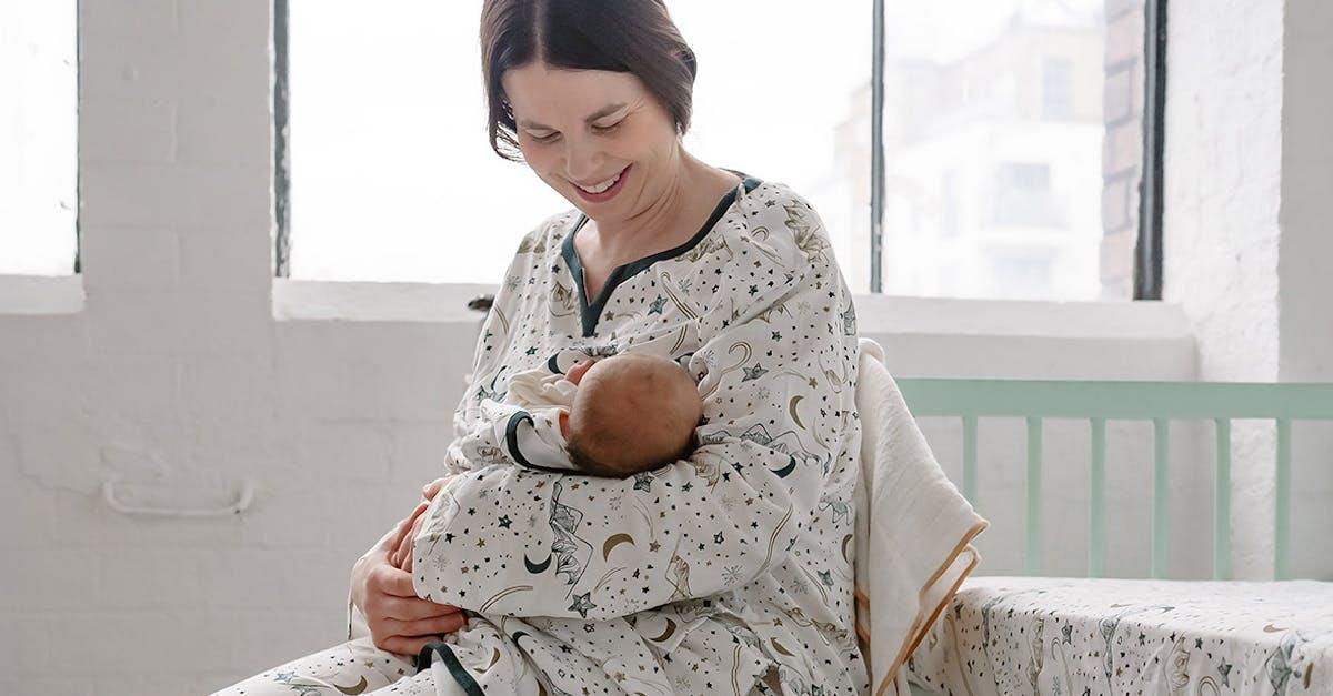 Mom with her newborn in Nest Designs nursing PJs